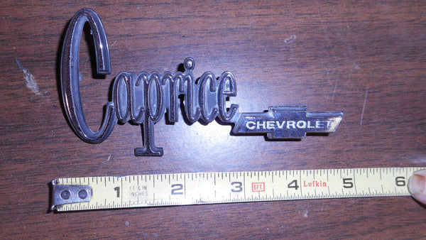 TRUNK LID EMBLEM, CAPRICE, 72-5 w/BOWTIE, USED