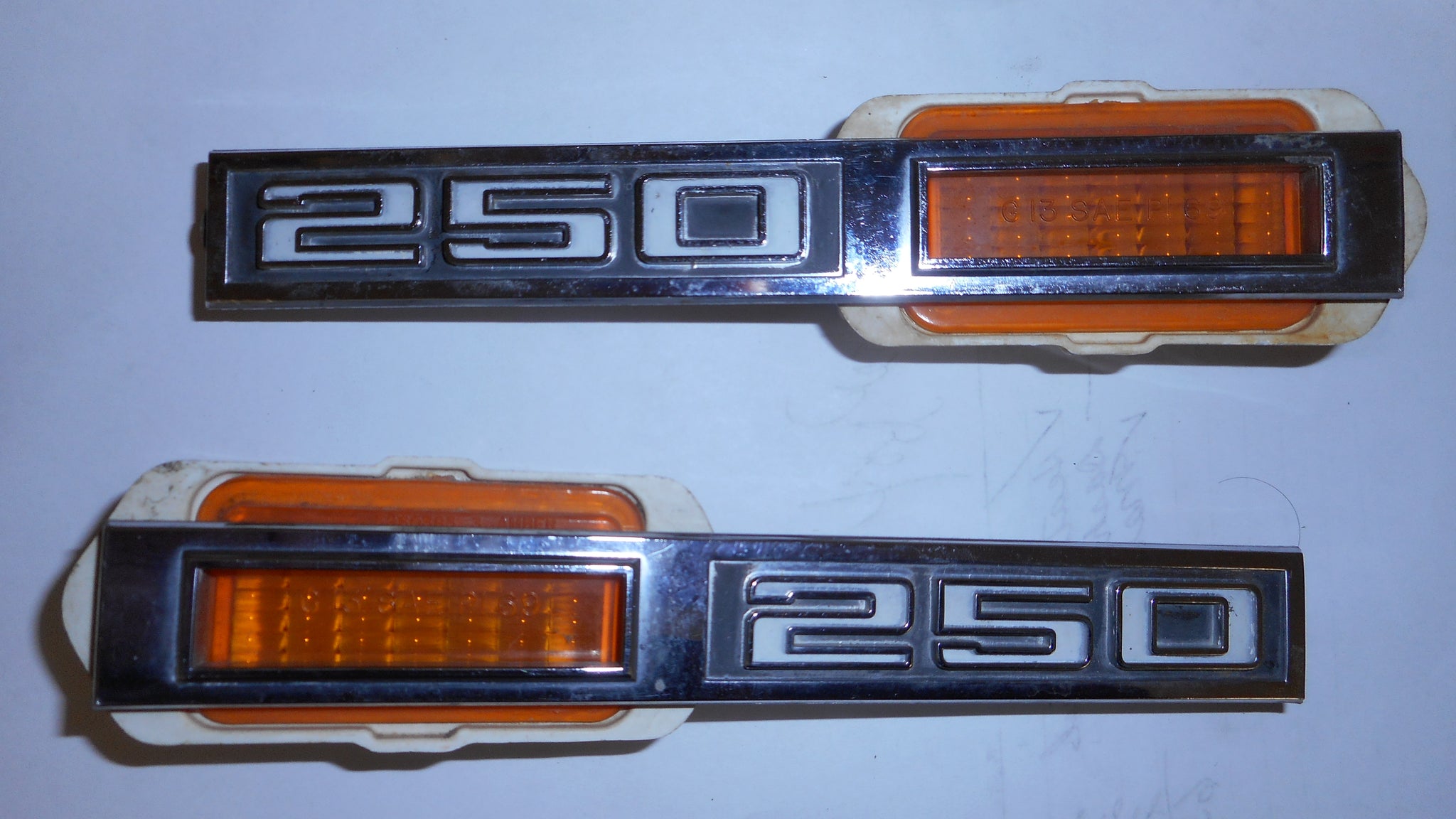 FENDER MARKER LIGHT BEZELS, ("250"), USED, pair, 69 CHEVELLE